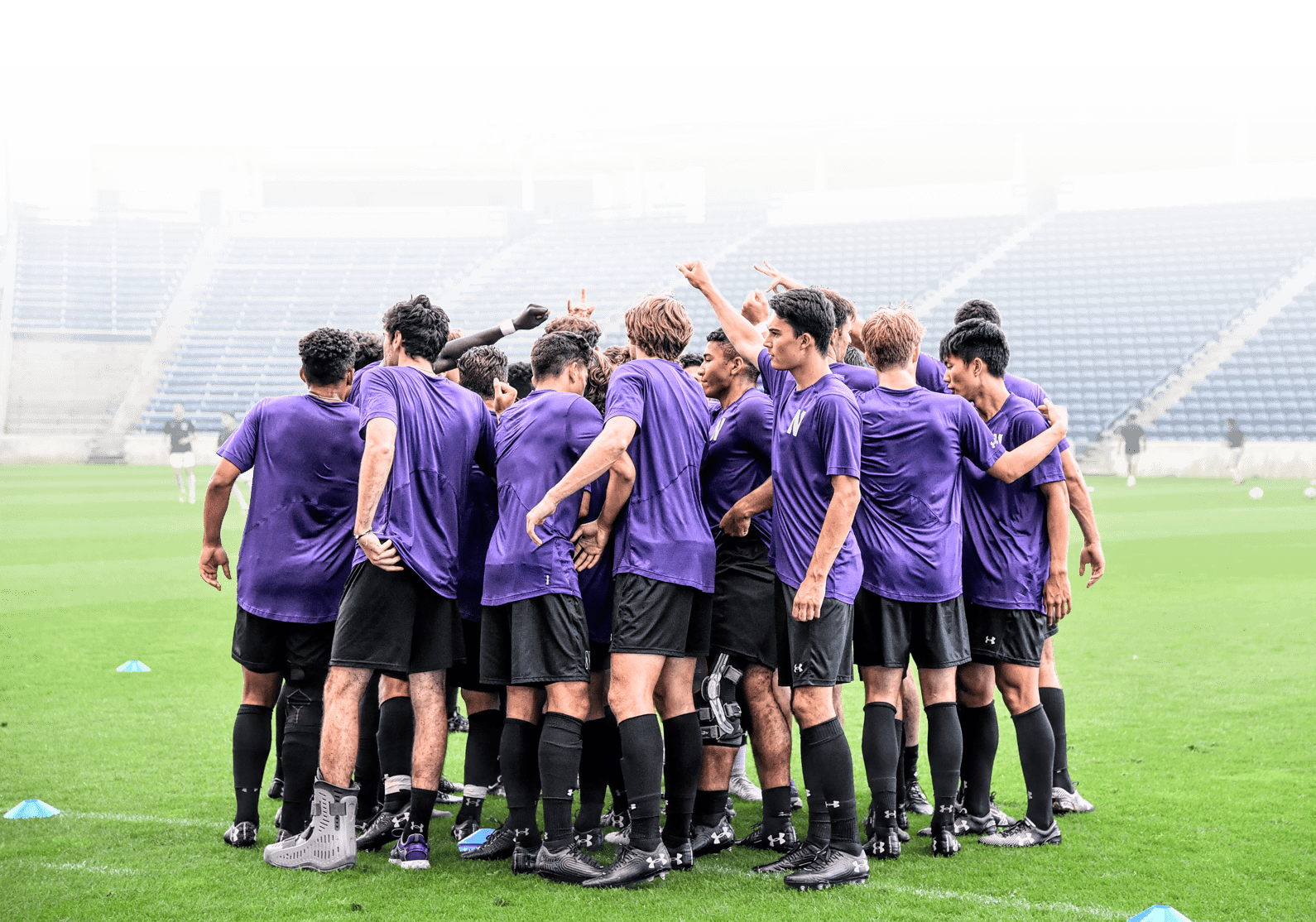 Soccer players in a huddle